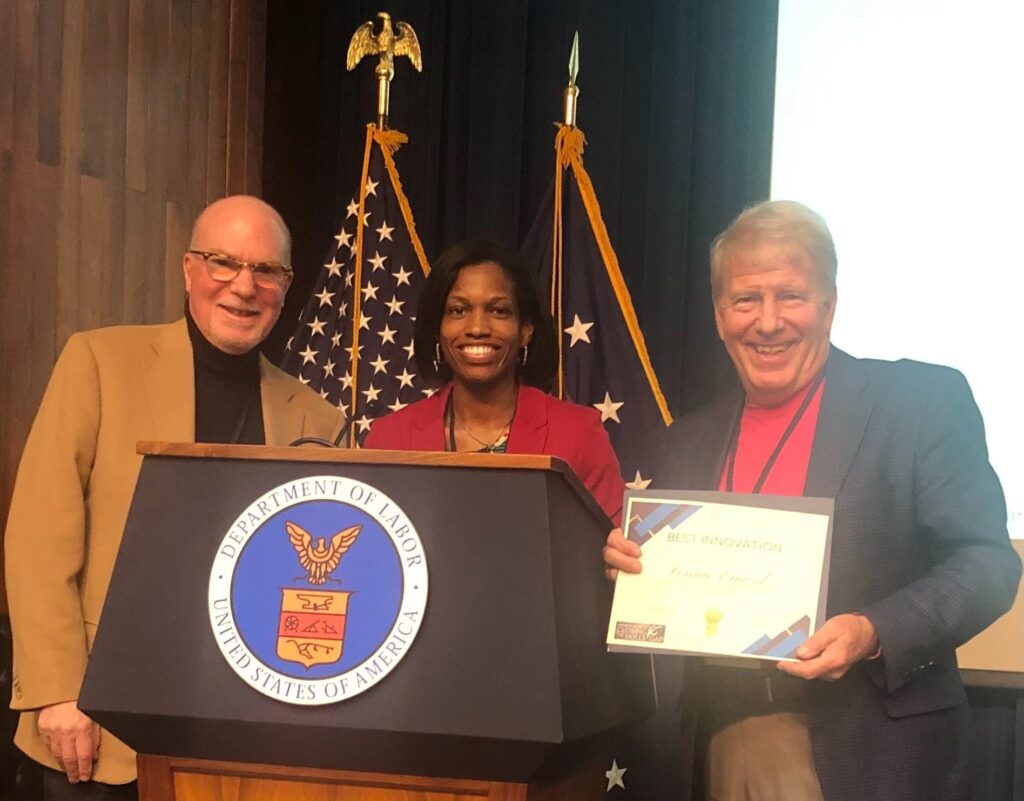 USDOL Recognizes Arkansas���s Leadership in Developing Successful Registered Apprenticeship Programs. Three people standing behind a podium that says "Department of Labor."