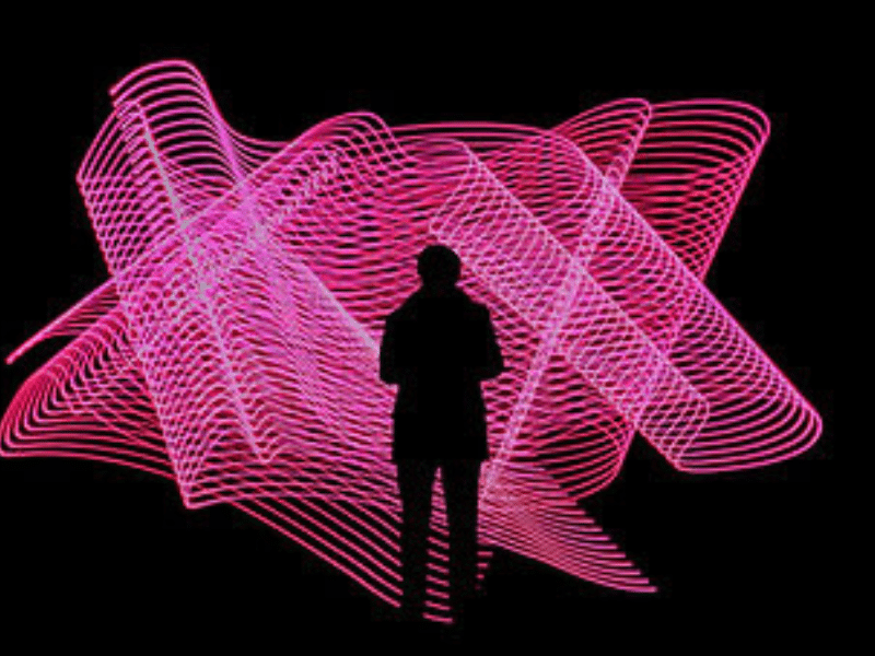 A black silhouette of a person standing in front of a swirling neon pink structure.